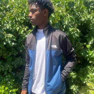 North Face lightweight blue and black zip-up jacket